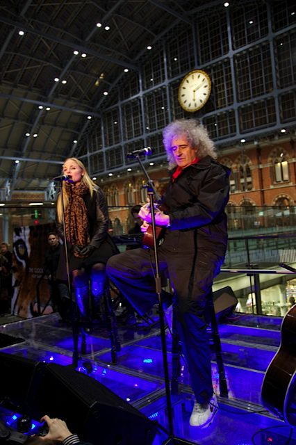Brian May performing at St. Pancras International.