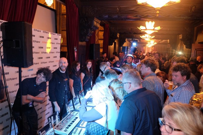 Attendees Trying to Outbid Each Other During Roland’s Silent Auction