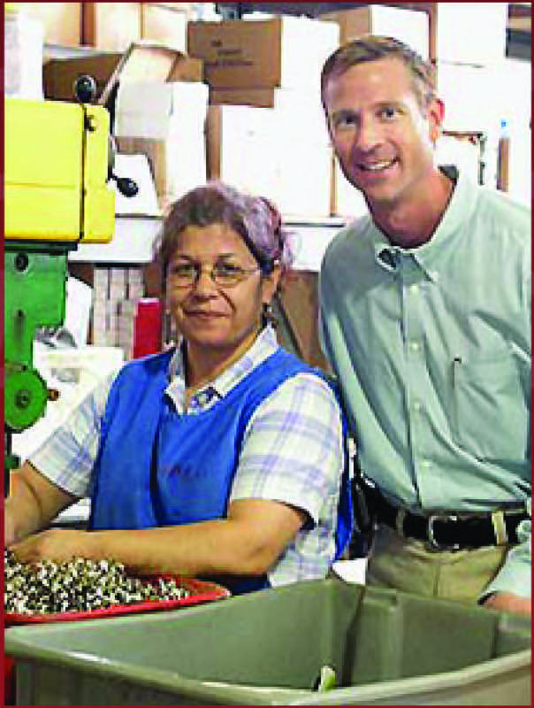 Karl Urban with a present-day employee.