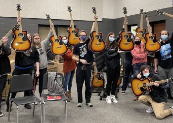 Students from Upperman High School in Baxter, TN, holding their new guitars, the result of a grant from the Guitar Center Music Foundation, who drew from Guitar Center’s in-store and online fundraising initiatives known as the “Round Up Your Change” program