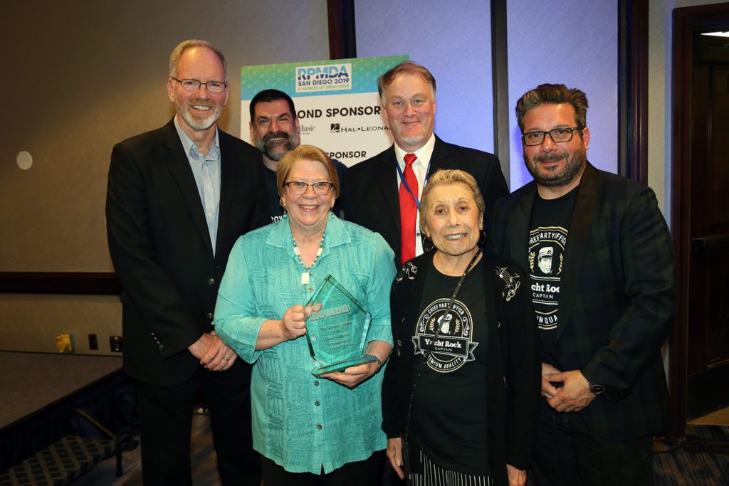 Lori Supinie pictured with Kevin Cranley, Bob Kohl, Eric Strouse, Iris and Ron Manus