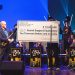 Jody Espina presents a check to Caleb Chapman for JodyJazz’s $10,000 donation to the Sound Support Foundation at their recent Scholarship concert in Salt Lake City