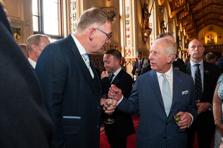 Rob Hanson, managing director of John Packer Musical Instruments, speaks with King Charles III during a reception at Windsor Castle