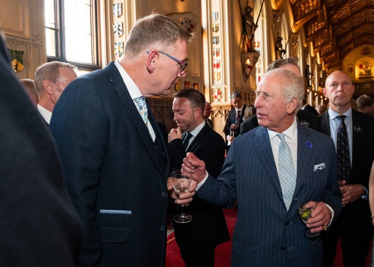 Rob Hanson, managing director of John Packer Musical Instruments, speaks with King Charles III during a reception at Windsor Castle