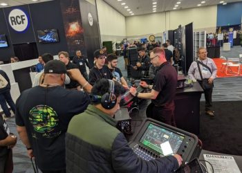 A product expert demonstrates the Allen & Heath Avantis at NAMM 2024