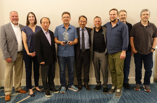 Reid Peterson (Audio-Technica U.S. Executive Director of Sales, Professional Markets); Julie Van Berg (Mavric Incorporated sales associate); Kazuo Matsushita (Audio-Technica Corporation CEO/President); Pete Petty (Mavric Incorporated principal); Manabu Aoki (Audio-Technica U.S. CEO/President); Jeff Beck (Audio-Technica U.S. Regional Sales Manager, System Solutions); and David Barrett, Jerry Silhavy and John Herr (Mavric Incorporated sales associates). Photo credit: Corey Walthall, Clyne Media