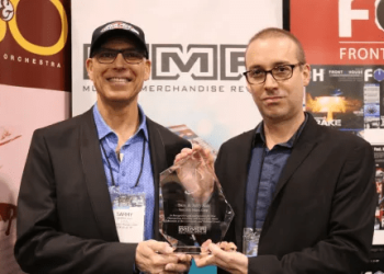 Sammy Ash is handed the 2019 MMR Don Johnson Industry Service Award by MMR executive editor Chrisitian Wissmuller