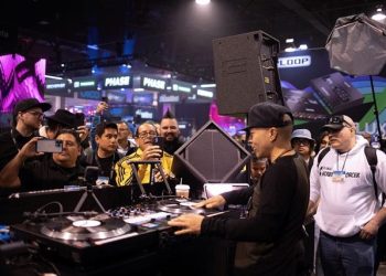 A DJ performing at the 2023 NAMM Show using MK3 DiaMons and DV12s